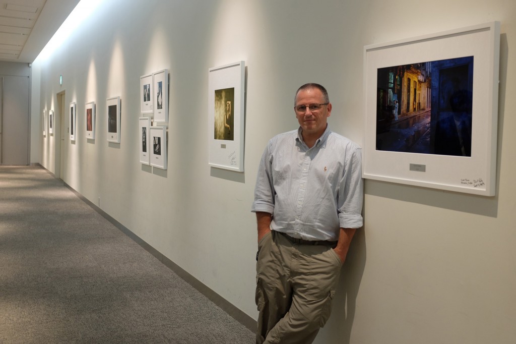 David Hobby next to his print on permanent display at Fuji international headquarters. Photo by Zack Arias, from Hobby's Flickr stream.